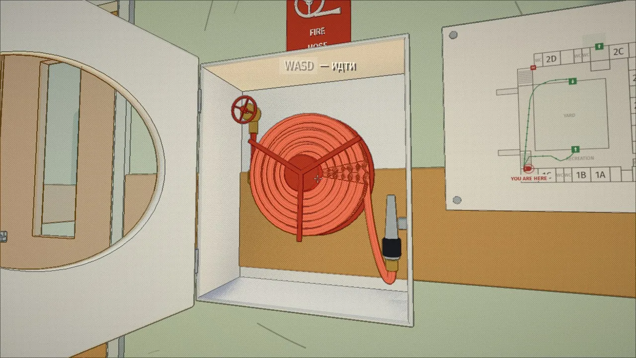 A fire hose cabinet, open: a valve with a handwheel, the hose on a reel, the nozzle